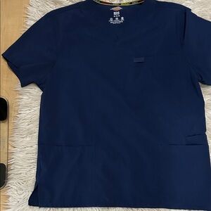 Dickies Men's Deep Blue Short Sleeve scrub top.